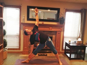 Lliam Bliss demonstrates triangle pose