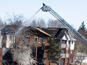 An explosion and fire happened at 45-unit in the area of Henry Street and Victoria Street South in Woodstock at approximately 8:30 a.m on March 27. Fire Fighters still fight the blaze at 2:30 p.m. Nine people are still unaccounted for due to the explosion. (Corrie Williams for the Expositor)