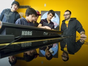 Music composer and producer-turned-instructor Arlen Yanch, right,  helps students Zach "Bigg Zee" Albert-French, left, Bayan Khajavi, Bennet Naylor and Roshan Giua as they create beats during a March Break rap camp at Nancy Campbell Collegiate Institute in London. The camp features lessons in writing, mixing, beat-making, and recording. CRAIG GLOVER/The London Free Press/QMI AGENCY