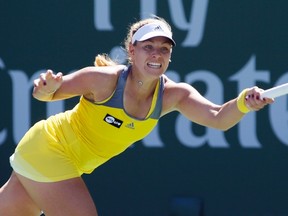 Angelique Kerber of Germany returns a shot against Yanina Wickmayer of Belgium during their match at the BNP Paribas Open WTA tennis tournament in Indian Wells, Calif., March 11, 2013. (REUTERS/Danny Moloshok)