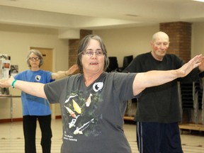 Taoist Tai Chi instructor Mary Robertson (centre) guides Barbara Donkin (left)  and Allen Karlson through a 108-movement sequence at a beginner class at St. Paul’s United Church on Wednesday. (Elizabeth McSheffrey/DailY Herald-Tribune)