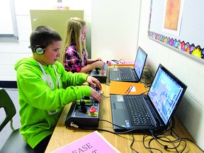 Colby Ramey (left) and Cassidy Cook-Redpath put their video game skills to the test for Serious Labs. Photo Supplied.