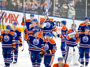 The Edmotnon Oilers salute the Rexall Place crowd at the end of their home opener in January. Oilers players say they need to create the kind of excitement that builds fan excitement. (Amber Bracken, Edmonton Sun)