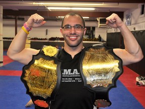 The Total Martial Arts Centre continues to make a name for itself as Josh Gagnon successfully defended his welterweight title this past weekend. He poses with both belts he has earned in his relatively short career in mixed martial arts.