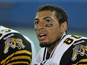 Hamilton Tiger-Cats wide receiver Chris Williams watches from the bench during the first half of their CFL football game against the Toronto Argonauts in Toronto Sept. 8, 2012. (REUTERS/Mike Cassese)