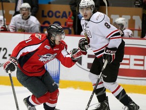 Windsor Spitfires Ryan Verbeek skates around Owen Sound Attack Cody Ceci in OHL action from WFCU Centre, Thursday.