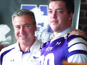 Former Stratford Central student Jimmy Hawley, right, is introduced as one of Western University's 2013 recruiting class by Mustangs' head coach Greg Marshall. (Submitted photo)