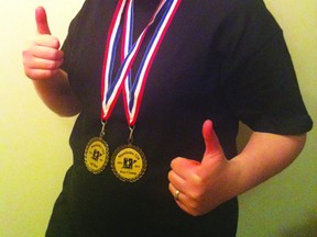 Danielle MacIntyre poses with her two medals won at the Manitoba 220 Provincials last month. (Submitted photo)