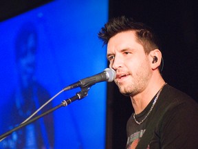 Canadian rocker and motivational speaker Robb Nash sings during his presentation on suicide, depression and bullying to students at PCI on Tuesday. (Svjetlana Mlinarevic/Portage Daily Graphic)