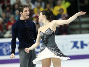 Scott Moir of Ilderton ends the ice dance short program with a howl beside partner Tessa Virtue of London at the world figure skating championships at Budweiser Gardens on Thursday night. Moir and Virtue are in second place behind American rivals Meryl Davis and Charlie White, below. (DEREK RUTTAN, The London Free Press)
