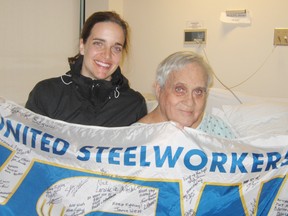 Longtime health and safety activist Homer Seguin gets a visit in hospital from granddaughter Michelle Malafarina-Marquis, and good wishes from executive members of USW Local 6500, the union local he once led.