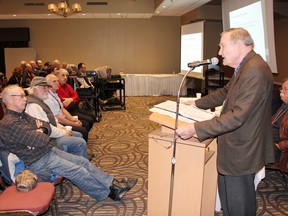 SEAN CHASE   Brian Crane, Ontario chief negotiator for the Algonquin land claim, speaks to a packed room at the Best Western Thursday night. Residents learned that 117,500 acres of Crown land are slated to be transferred to Algonquin ownership under the land claim’s preliminary agreement-in-principle.