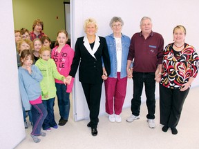 SEAN CHASE   The Eganville and District Seniors Centre now has a fully operational retractable wall thanks to grant funding. Here a group of young people joins (left to right) Renfrew-Nipissing-Pembroke MP Cheryl Gallant, volunteer Joyce Gutzeit, volunteer Ken Caldwell and activities co-ordinator Shelley Macleod.