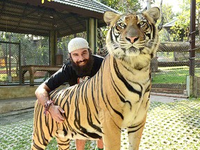 Chatham native Kevin Moore is pictured with this tiger while in Thailand, which is an example of one of the many adventures he's enjoying while backpacking around the world. Undated photo.
CONTRIBUTED/ THE CHATHAM DAILY NEWS/ QMI AGENCY