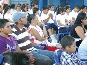 Audience members listen to speeches at the opening of a classroom at Los Almendros high school in Suchitoto, El Salvador, in February. (CONTRIBUTED PHOTO)