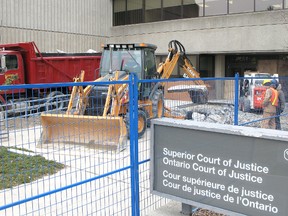Demolition of the concrete slab in front of the main entrance to the Chatham courthouse started Friday. The work is part of a seven-month project to provide a temporary entrance and a new lobby. A building permit with a value of $500,000 was issued for the project. VICKI GOUGH/ THE CHATHAM DAILY NEWS/ QMI AGENCY