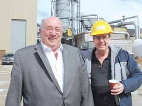 Perth-Wellington MP Gary Schellenberger, left, and Dave Smith, president of Atwood Resources, are shown Friday in front of the almost-completed gasification plant that's expected to begin operations in about a month.  (DONAL O'CONNOR, The Beacon Herald)