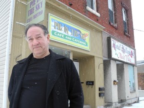 Stephen Hull stands in front of the his wife's Pie in the Sky Cafe in Napanee. The cafe has been closed because the vacant building next door has partially collapsed and the town has cordoned off the whole area.                                                               
Elliot Ferguson The Whig-Standard