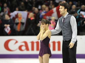 Canadian skaters Meagan Duhamel and Eric Radford of Canada celebrate after competing in the pairs free skating event at the ISU World Figure Skating Championships at Budweiser Gardens in London Friday. CRAIG GLOVER/The London Free Press/QMI AGENCY