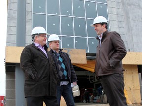 Sarnia-Lambton Chamber of Commerce president Rory Ring (left) and Adam Rose (director of membership development and sales) chat with Cineplex Entertainment's Mike Langdon outside the new Galaxy Cinemas Sarnia, Ont. theatre, Friday March 15, 2013. The $5 million, state-of-the-art facility is on schedule to open in the spring. (TARA JEFFREY, The Observer)