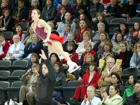 Empty seats dot the crowd as American figure skaters Marissa Castelli and Simon Shnapir compete in the pairs free skating program at the ISU World Figure Skating Championships at Budweiser Gardens in London on Friday. CRAIG GLOVER The London Free Press / QMI AGENCY