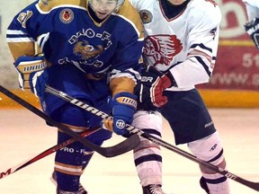 Stratford Cullitons' Ryker Killins, right, battles with Caledonia Corvairs' Adam Brady in a GOJHL Midwestern conference playoff game last spring. Killins has made a verbal commitment to attend Ferris State University in 2015. (SCOTT WISHART/ The Beacon Herald)