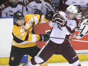 Kingston Frontenacs’ Billy Jenkins and Peterborough Petes’ Cody Thompson collide near centre ice during an Ontario Hockey League game at the K-Rock Centre. After being released by the Petes, Thompson tried out in the QMJHL and is heading to the OJHL. Michael Lea/The Whig-Standard/QMI Agency file photo