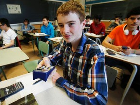 Cole MacDonald uses a "clicker" during math class, which lets his teacher know whether students understand the lesson. Bloor Collegiate is one of the fastest-improving schools in Toronto. (CRAIG ROBERTSON/Toronto Sun)