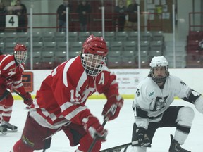 Kenora’s Chris Varrin (15) cycles the puck with Thunder Bay’s Jesse Taylor watching closely in Saturday’s second game of the Hockey Northwestern Ontario branch championship at the Kenora Recreation Centre.
LLOYD MACK/Daily Miner and News