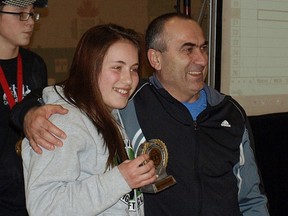 Abby Jurchuk receives her Top Juvenile Female Lifter award from world record holder, world champion and Olympic bronze medallist Alexendar Varbanov.