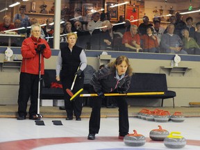 DANIEL R. PEARCE  Simcoe Reformer
Skip  Ann LaFontaine of Toronto, right, studies her next move as Jim Simmons and Donna Hawkins from Simcoe watch on during the Ontario Vision-Impaired Curling championship on Saturday.