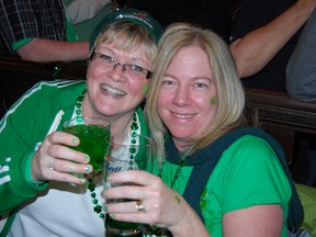 Friends Lisa Dunn and Sylvia Ernhardt thought ahead and booked March 18 off work. The pair along with other friends were among hundreds that celebrated St. Patrick's Day at the Charles Dickens Pub over the weekend. (TARA BOWIE, Sentinel-Review)