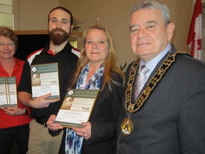MONTE SONNENBERG Simcoe Reformer
Norfolk County handed out awards last week under its Employee Suggestion Program. Among the county employees cited were Adam Wills, second from left, and Jeannette Herod, second from right. At right is Mayor Dennis Travale while at left is Val Holland, a supervisor at Norview Lodge who collected three plaques for winners who were unable to attend last Tuesday’s council meeting.