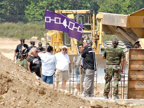 In a July 2008 photo, Six Nations protesters are shown waiting for construction workers to leave the Kingspan development site on Fen Ridge Court in the northwest industrial area. (Expositor file photo)