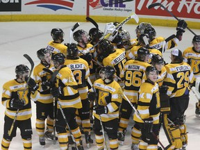 Members of the Kingston Frontenacs celebrate the club’s 5-1 win over the Ottawa 67’s on Sunday at the K-Rock Centre. The win, combined with Peterborough’s 5-2 loss to Brampton on Sunday means Kingston finishes seventh in the OHL’s Eastern Conference and will play the Barrie Colts in the first round of the playoffs. (Ian MacAlpine The Whig-Standard)
