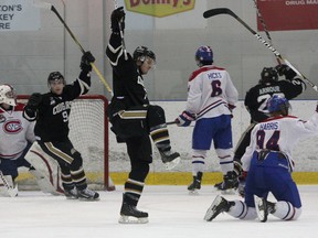 Cobourg Cougars' Jake Emilio celebrates a power-play goal against Kingston Voyageurs' goalie Charlie Finn during Ontario Hockey Junior League playoff action at the Invista Centre. Cobourg won the game 4-1, cutting the Vees' series lead to 2-1. (Ian MacAlpine/The Whig-Standard)