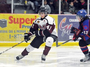 Chatham Maroons' Eric Palazzolo, left, skates away from Strathroy Rockets' Kurtis Sander in the third period Sunday at Memorial Arena. (MARK MALONE/The Daily News)