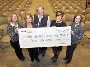 Lori Harding, Cheryl Hewson, Wendy Huys and Cathy Sprauge presented Tiffany Love with a cheque for $7,000 to sponsor the International Women's Day Celebration which Women's House hosts each year.