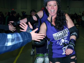 A few bumps, bruises and wipeouts couldn't stop the Woodstock Warriors roller derby team from winning its second home game Saturday night at the Oxford Auditorium. The Warriors beat the Durham Region roller derby team 167-150.
TARA BOWIE / SENTINEL-REVIEW / QMI AGENCY