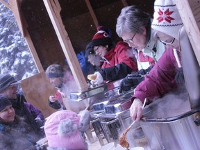 Traditional French foods  were doled out to hungry attendees at the 2013 Sugar Shack Festival held in Bonnyville on March 16. See all pictures at www.coldlakesun.com and on page 36.