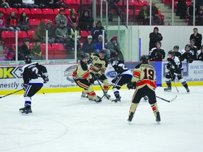 The Cold Lake Ice and the Wainwright Bisons scramble for the puck during a Mar. 16 game at the Energy Centre - the first of the North Eastern Alberta Junior B Hockey League finals. The ice dropped a 4-3 decision that night, but rebounded the next evening to defeat the Bisons 5-1. The next two games, on Mar. 22 and 23, will be played in Wainwright.