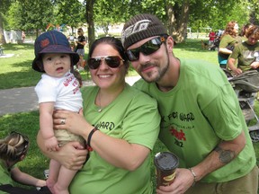 Sarnia's Lisa Headrick, shown here with her husband Ward Headrick and their child, is leading efforts to organize the Sarnia Walk for Muscular Dystrophy May 25 at Canatara Park. The fundraising walk begins at 11 a.m., with registration at 10 a.m. The goal is $10,000. SUBMITTED PHOTO