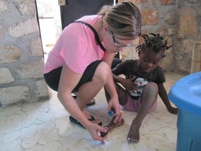 Tracey Dibben paints one of the children toe nails during some free time at God’s Littlest Angels.
Submitted