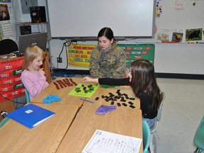 Central School Grade 5 student, Autumn Lunde, (m), plays a game of dominoes with Serena Abraham and Ellie Walsh on Tuesday, March 12 as part of Pat Hardy Primary School’s Reading Buddy program.
Barry Kerton | Whitecourt Star