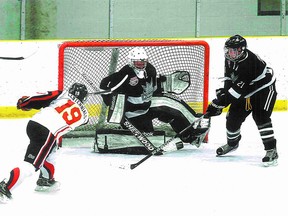 Squires goalie Zac Klassen makes a big save during his team’s 5-0 victory over the K of C Centennials in the recent Sutter North Cup. Photo supplied.