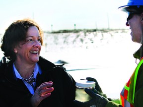 Premier Alison Redford speaks with Suncor environmental specialist Christine Daly at the company’s Wapisiw Lookout reclaimed tailings pond in this March 2012 file photo. VINCENT MCDERMOTT/TODAY STAFF