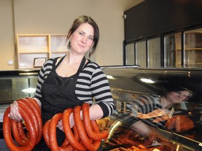 Rachel Zep holds some beef coils at the new Europa Deli Sausage Hut in the south end (in the same strip as the Shoppers Drug Mart just off 108 Street) on Monday. Rachel and her husband Rafal are carrying on the Zep family business in Grande Prairie.
PATRICK CALLAN/DAILY HERALD-TRIBUNE