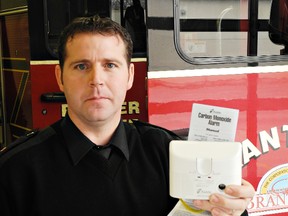 Brantford fire prevention officer Scott Hardwick displays a carbon monoxide detector. Working detectors prevented tragedies at two city homes last week, he said.