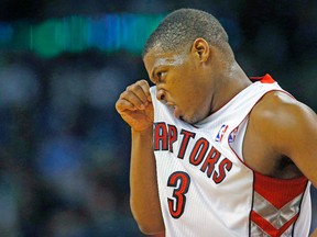 Raptors’ Kyle Lowry wipes his face during a game last week. The point guard had an awful day on Sunday against the Heat, failing to score a point or make a trip to the free-throw line. (REUTERS)