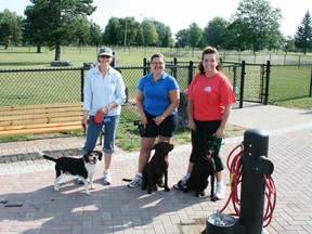 South Dundas residents pose in front of the Morrisburg dog park after its official opening in August 2011. A Cornwall group is aiming to build a similar facility in the city, and will present their proposal to the waterfront development committee this week.
File photo